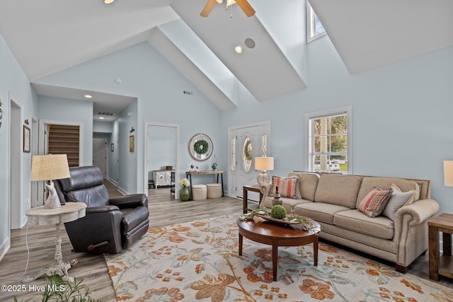 505 Davidson Dr, Newport, NC 28570 - living area featuring high vaulted ceiling, wood finished floors, a ceiling fan, and a skylight