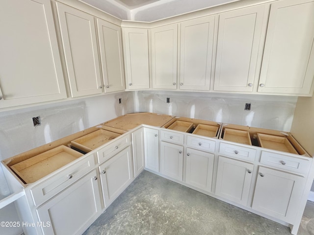 919 Albrittons Rd, Kinston, NC 28504 - kitchen featuring concrete flooring, white cabinetry, and light countertops