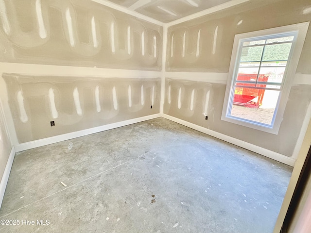 919 Albrittons Rd, Kinston, NC 28504 - spare room featuring unfinished concrete floors and baseboards