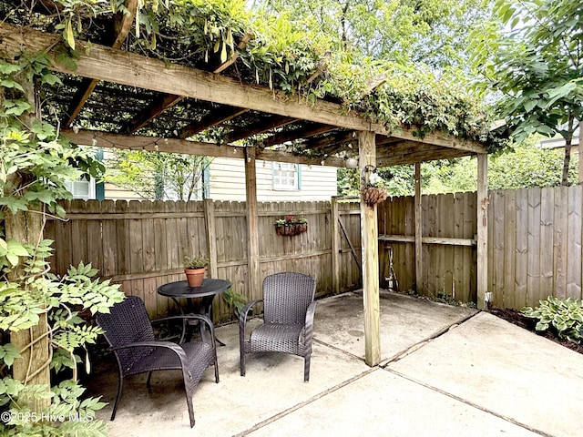 228 Mcrae St, Wilmington, NC 28401 - fenced backyard featuring a pergola and a patio area