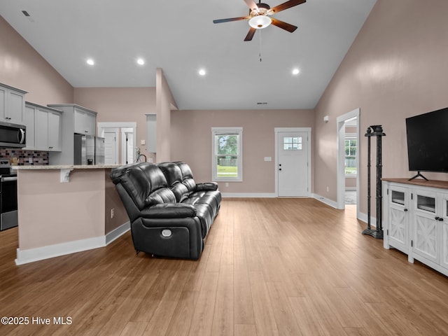 500 Perth Ct, Hubert, NC 28539 - living area with ceiling fan, light wood-type flooring, high vaulted ceiling, and recessed lighting