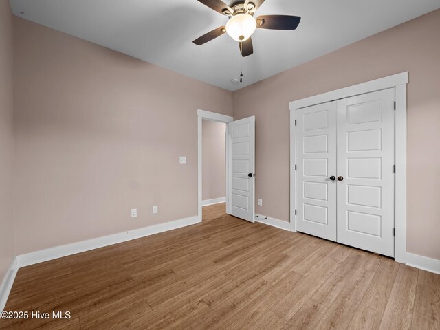 500 Perth Ct, Hubert, NC 28539 - unfurnished bedroom with wood finished floors, a closet, and ceiling fan