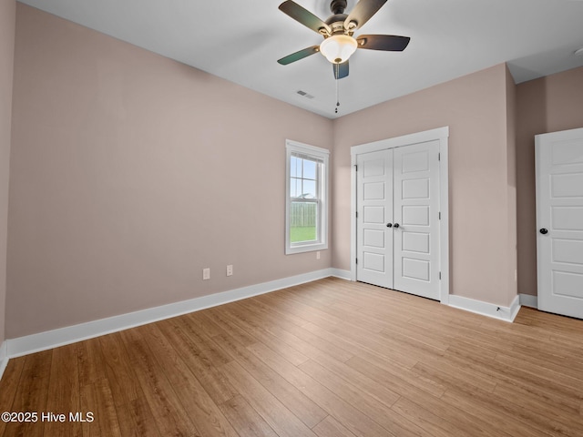 500 Perth Ct, Hubert, NC 28539 - unfurnished bedroom with a closet, light wood-style flooring, and a ceiling fan