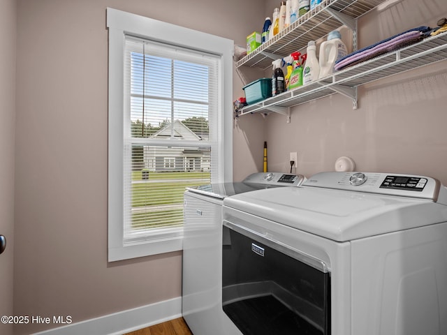 500 Perth Ct, Hubert, NC 28539 - washroom with washing machine and clothes dryer and wood finished floors