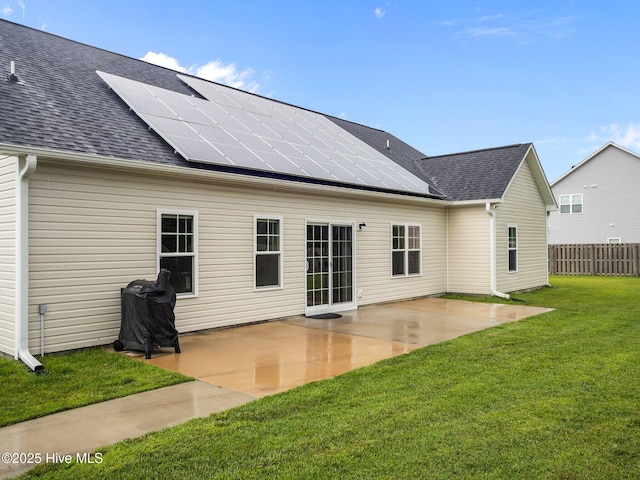 500 Perth Ct, Hubert, NC 28539 - back of property featuring solar panels, a patio, and a shingled roof