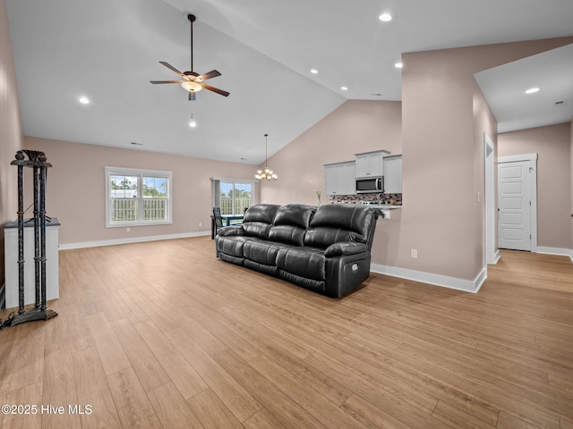 500 Perth Ct, Hubert, NC 28539 - living room featuring ceiling fan, high vaulted ceiling, light wood finished floors, a chandelier, and recessed lighting