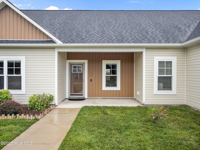 500 Perth Ct, Hubert, NC 28539 - entrance to property featuring roof with shingles, board and batten siding, and a lawn