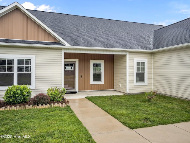 500 Perth Ct, Hubert, NC 28539 - property entrance featuring board and batten siding, roof with shingles, and a yard