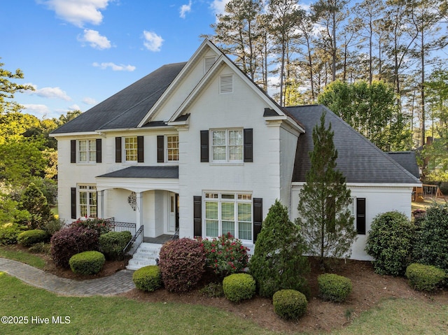 3902 Kipling Ct, Greenville, NC 27834 - view of front of property featuring roof with shingles, brick siding, and covered porch