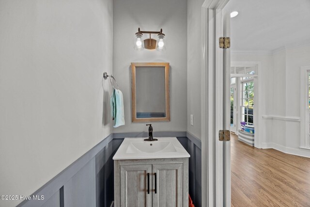 3902 Kipling Ct, Greenville, NC 27834 - bathroom featuring vanity, crown molding, and wood finished floors