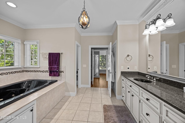 3902 Kipling Ct, Greenville, NC 27834 - bathroom featuring healthy amount of natural light, vanity, a whirlpool tub, crown molding, and tile patterned floors