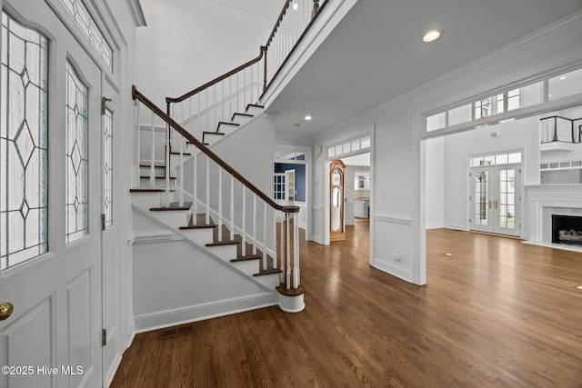 3902 Kipling Ct, Greenville, NC 27834 - foyer with french doors, stairway, crown molding, wood finished floors, and recessed lighting
