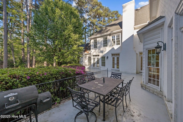 3902 Kipling Ct, Greenville, NC 27834 - view of patio with french doors and outdoor dining space