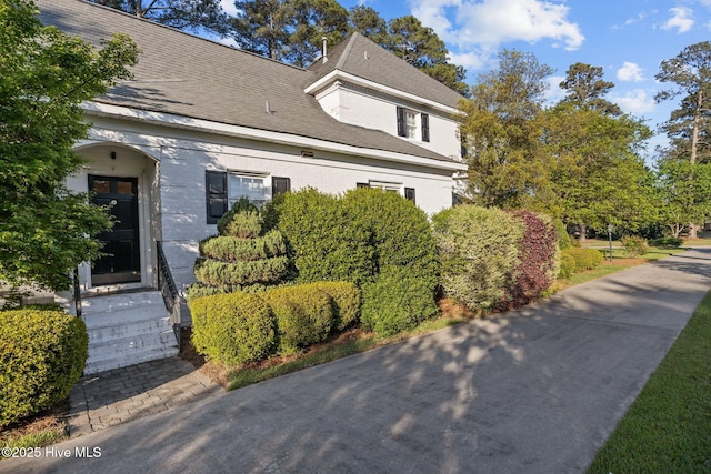 3902 Kipling Ct, Greenville, NC 27834 - view of front of house with entry steps, roof with shingles, and brick siding