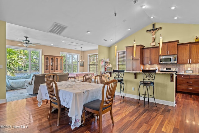9406 Voyagers Way, Wilmington, NC 28412 - dining area featuring dark wood-type flooring, a ceiling fan, recessed lighting, and high vaulted ceiling