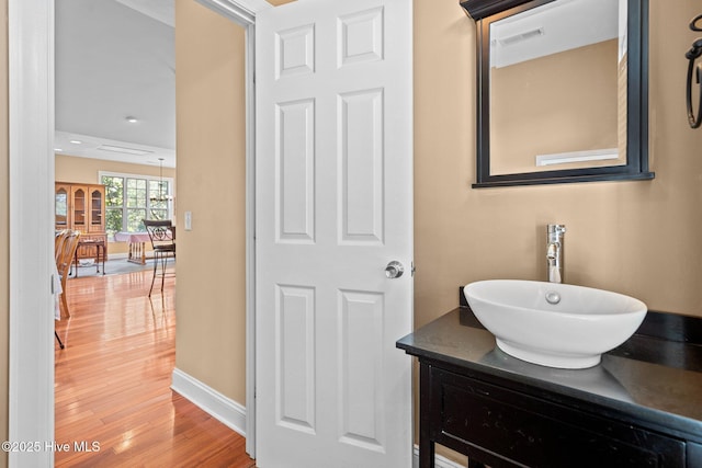 9406 Voyagers Way, Wilmington, NC 28412 - bathroom with wood finished floors and vanity