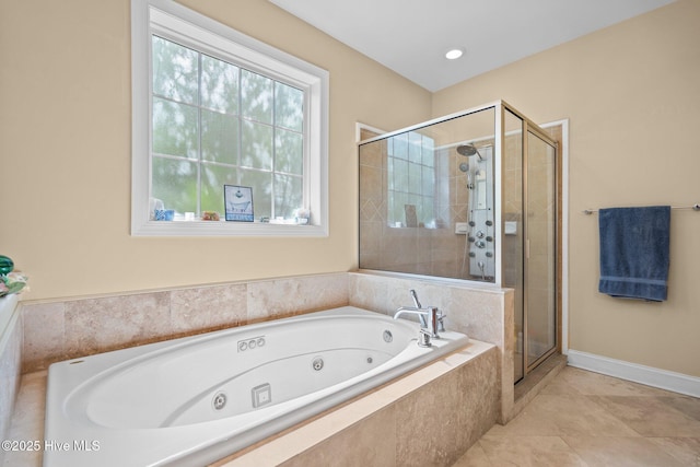 9406 Voyagers Way, Wilmington, NC 28412 - bathroom with a shower stall, a whirlpool tub, and tile patterned floors