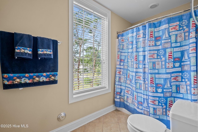 9406 Voyagers Way, Wilmington, NC 28412 - bathroom featuring tile patterned floors, plenty of natural light, and a shower with shower curtain