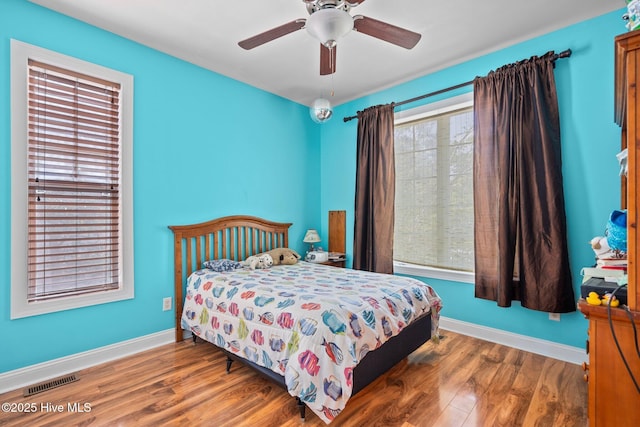 9406 Voyagers Way, Wilmington, NC 28412 - bedroom featuring wood finished floors and ceiling fan