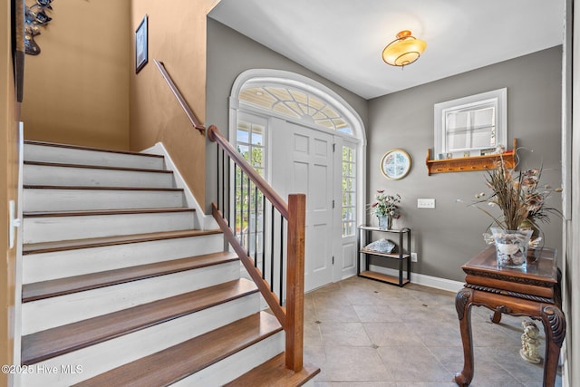 9406 Voyagers Way, Wilmington, NC 28412 - foyer entrance featuring stairs and tile patterned floors
