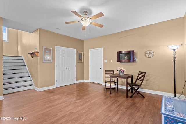 9406 Voyagers Way, Wilmington, NC 28412 - entryway featuring ceiling fan, stairs, and wood finished floors