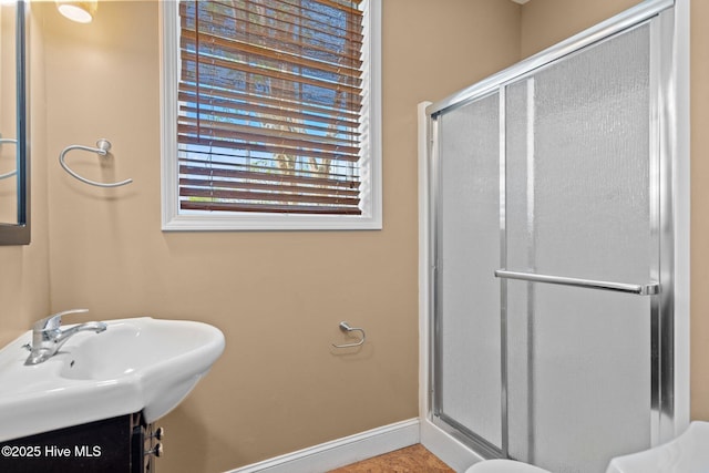 9406 Voyagers Way, Wilmington, NC 28412 - bathroom with a shower stall and baseboards
