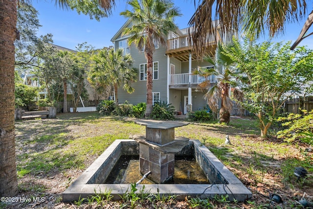 9406 Voyagers Way, Wilmington, NC 28412 - view of yard with a balcony