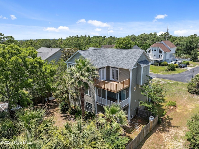 9406 Voyagers Way, Wilmington, NC 28412 - view of subject property with a tree filled landscape