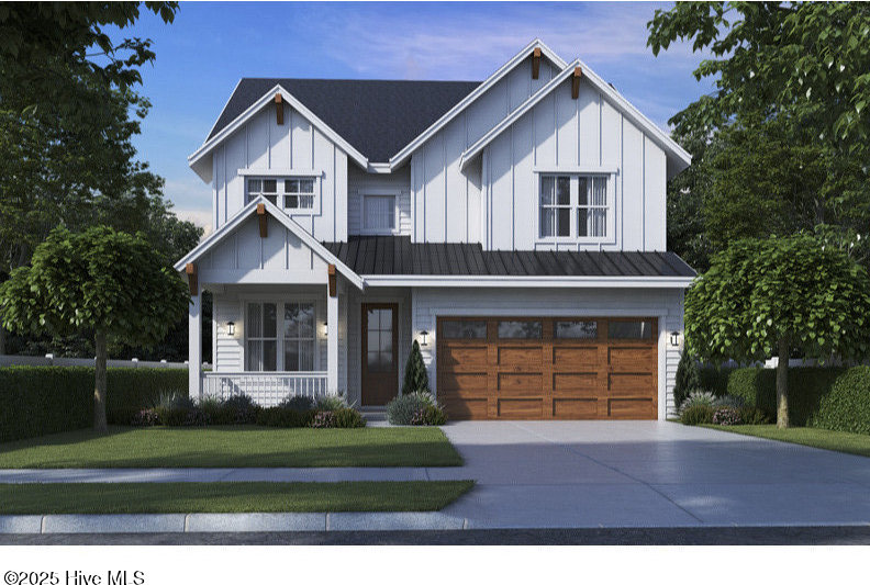 modern farmhouse with board and batten siding, concrete driveway, a porch, and a garage