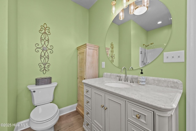4340 Island Dr, North Topsail Beach, NC 28460 - bathroom with vanity and wood finished floors