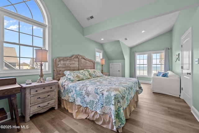 4340 Island Dr, North Topsail Beach, NC 28460 - bedroom with lofted ceiling, wood finished floors, and recessed lighting