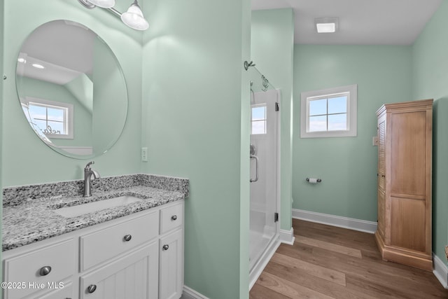4340 Island Dr, North Topsail Beach, NC 28460 - bathroom featuring vanity, wood finished floors, and a shower stall