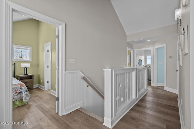 4340 Island Dr, North Topsail Beach, NC 28460 - hall featuring an upstairs landing, high vaulted ceiling, and wood finished floors