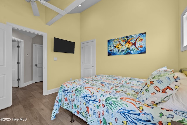 4340 Island Dr, North Topsail Beach, NC 28460 - bedroom featuring wood finished floors and a towering ceiling