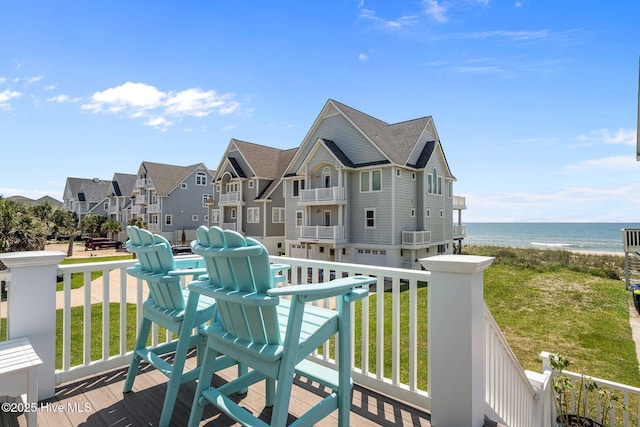 4340 Island Dr, North Topsail Beach, NC 28460 - deck with a water view, a residential view, and a yard