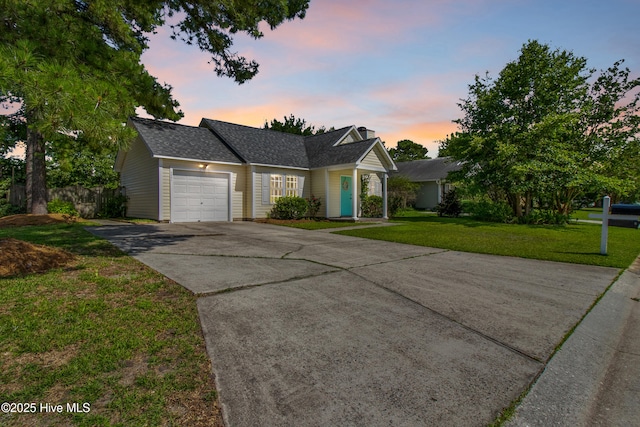 5601 W Chop Way, Wilmington, NC 28412 - traditional-style house with an attached garage, concrete driveway, and a shingled roof