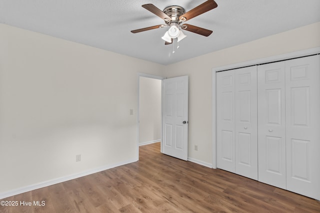 5601 W Chop Way, Wilmington, NC 28412 - unfurnished bedroom featuring wood finished floors, a closet, and a ceiling fan