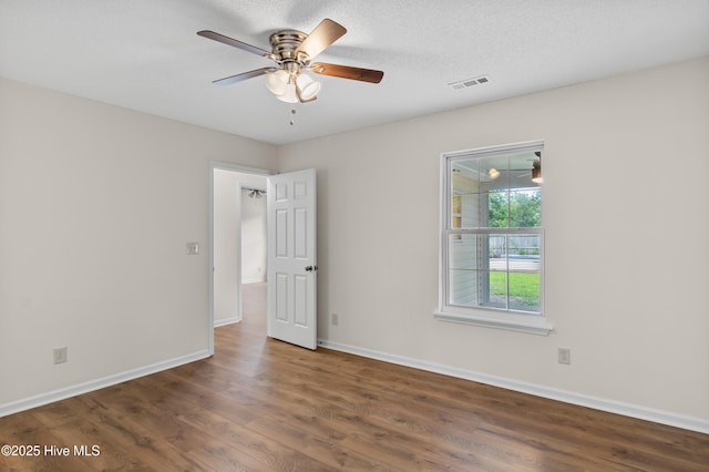 5601 W Chop Way, Wilmington, NC 28412 - spare room featuring wood finished floors and a ceiling fan
