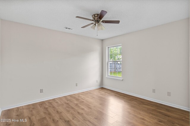 5601 W Chop Way, Wilmington, NC 28412 - unfurnished room featuring wood finished floors and a ceiling fan