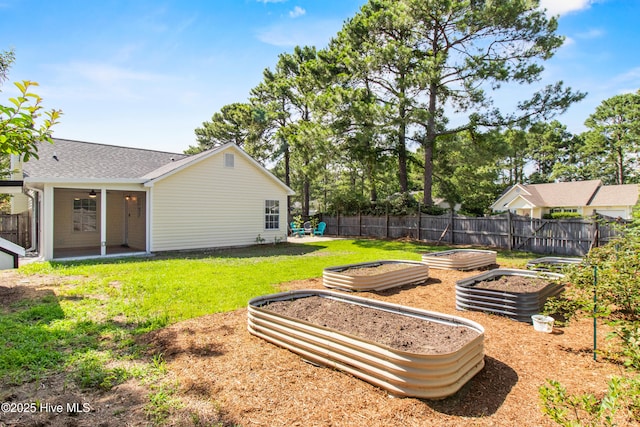 5601 W Chop Way, Wilmington, NC 28412 - view of yard featuring a garden and a ceiling fan