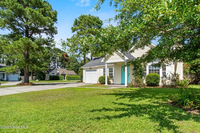 5601 W Chop Way, Wilmington, NC 28412 - obstructed view of property featuring concrete driveway, a garage, and a front lawn