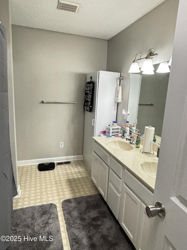 103 Jay Trl, Murfreesboro, NC 27855 - bathroom with double vanity and a textured ceiling
