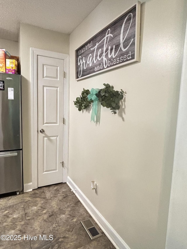 103 Jay Trl, Murfreesboro, NC 27855 - unfurnished dining area with baseboards and a textured ceiling