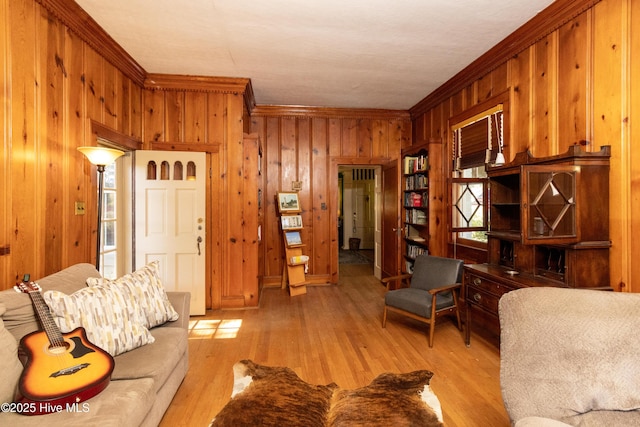 119 S Main St, Colerain, NC 27924 - living area featuring wood walls, crown molding, and light wood finished floors