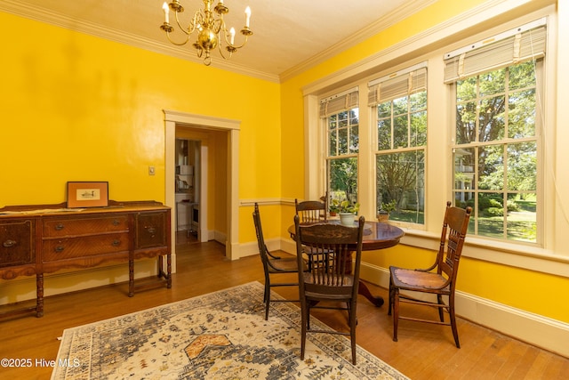 119 S Main St, Colerain, NC 27924 - dining area featuring a chandelier, crown molding, and wood finished floors