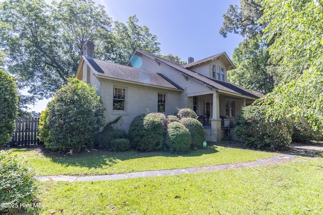 119 S Main St, Colerain, NC 27924 - view of front of home with a chimney, a porch, brick siding, and a shingled roof
