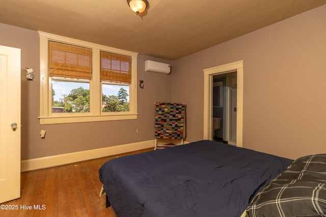 119 S Main St, Colerain, NC 27924 - bedroom featuring a wall mounted AC and wood finished floors