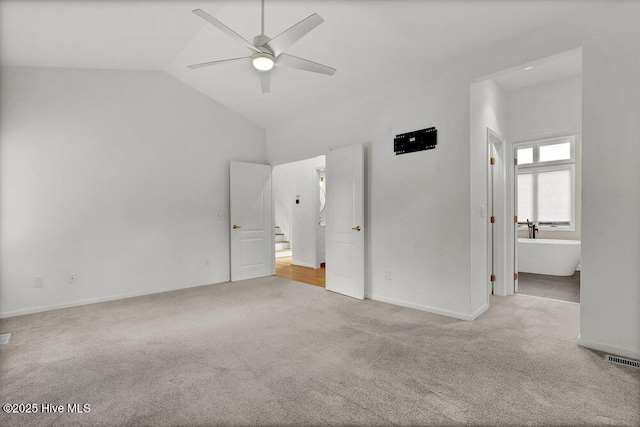 108 Sound View Dr, Hampstead, NC 28443 - unfurnished bedroom featuring carpet, vaulted ceiling, and a ceiling fan