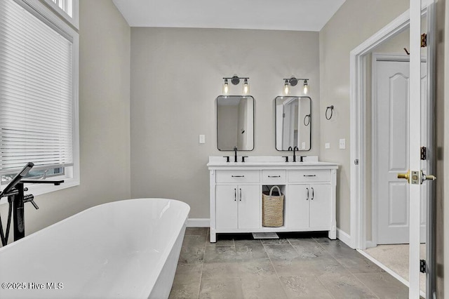 108 Sound View Dr, Hampstead, NC 28443 - bathroom featuring double vanity and a freestanding bath