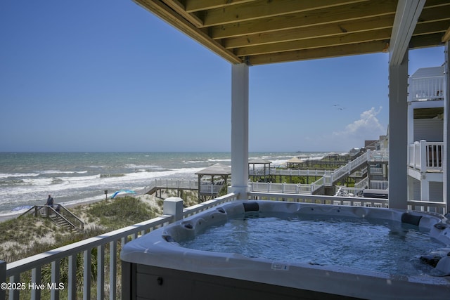 1326 New River Inlet Rd, North Topsail Beach, NC 28460 - balcony with a hot tub and view of water and beach